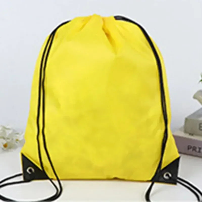 Bright yellow drawstring bag with black cord straps and reinforced corner eyelets.