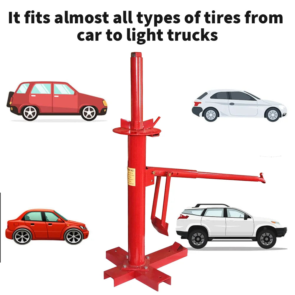 Red manual tire changer with a vertical post, a four-way base, and an adjustable demount arm, surrounded by cars.