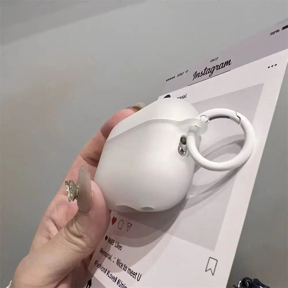 Matte white silicone AirPods Pro case with a matching circular keyring clip. Packaging features Instagram UI design.