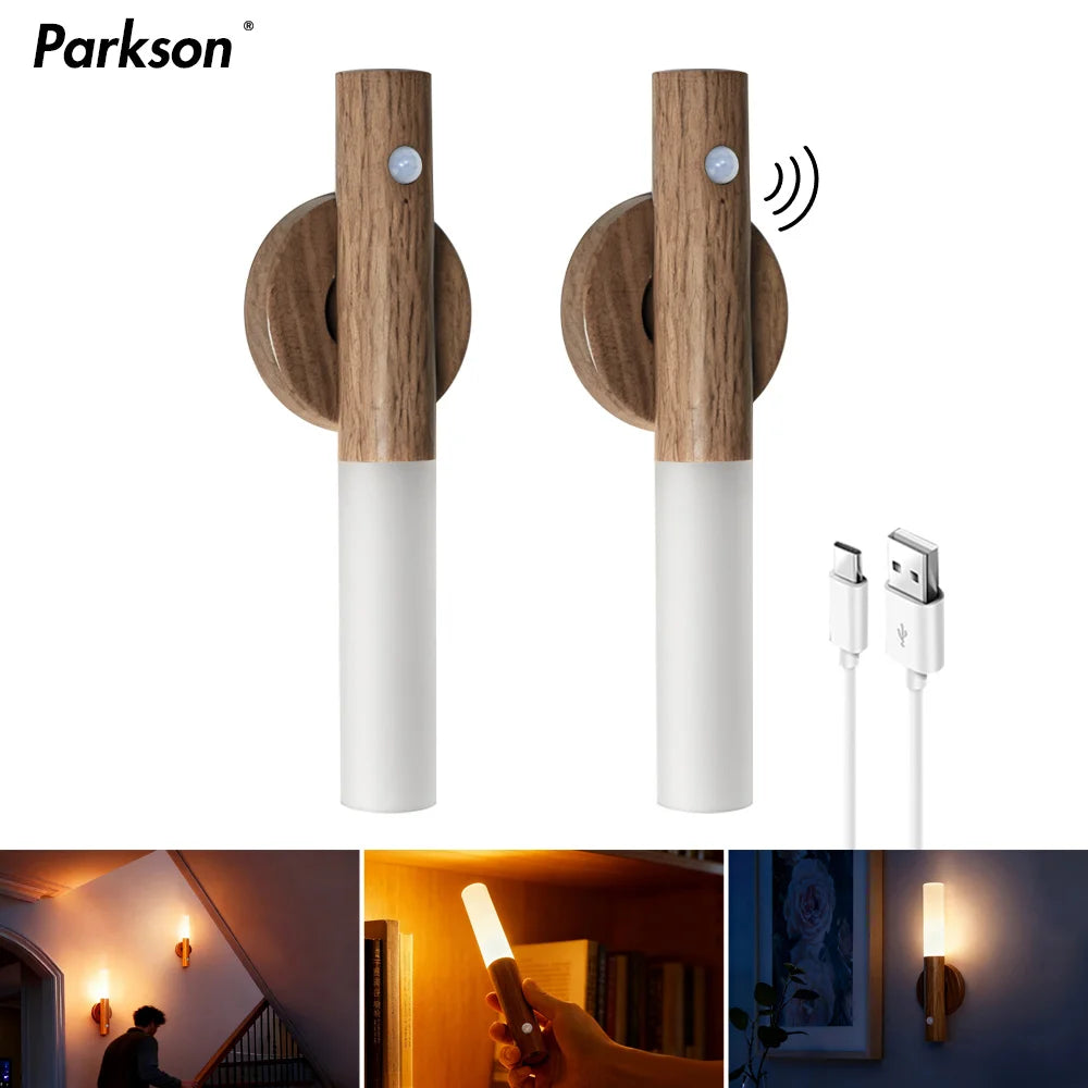 Two sleek, wood-effect magnetic LED night lights with motion sensors and a USB charging cable on a white background.