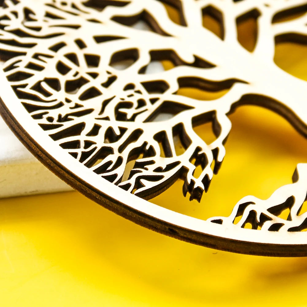 Laser-cut circular light wood tree of life wall art with intricate branch detailing on a bright yellow background.
