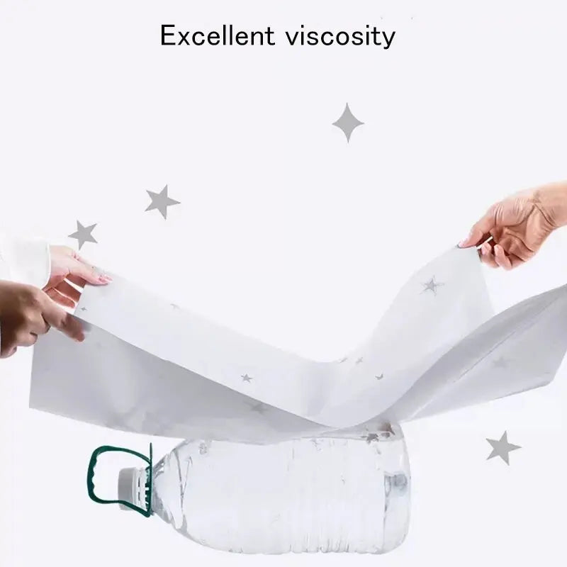 Two hands peeling the back off a white, star-patterned 3D self-adhesive wall tile to show strong sticky backing.