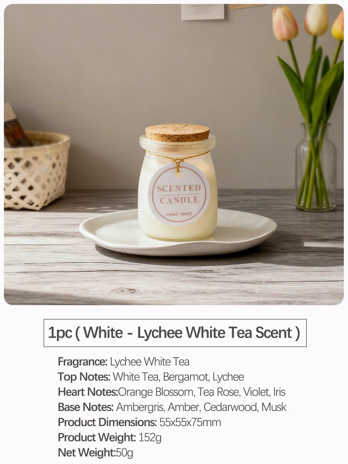 White scented candle in a glass jar with a cork lid and a gold string tag on a white plate.