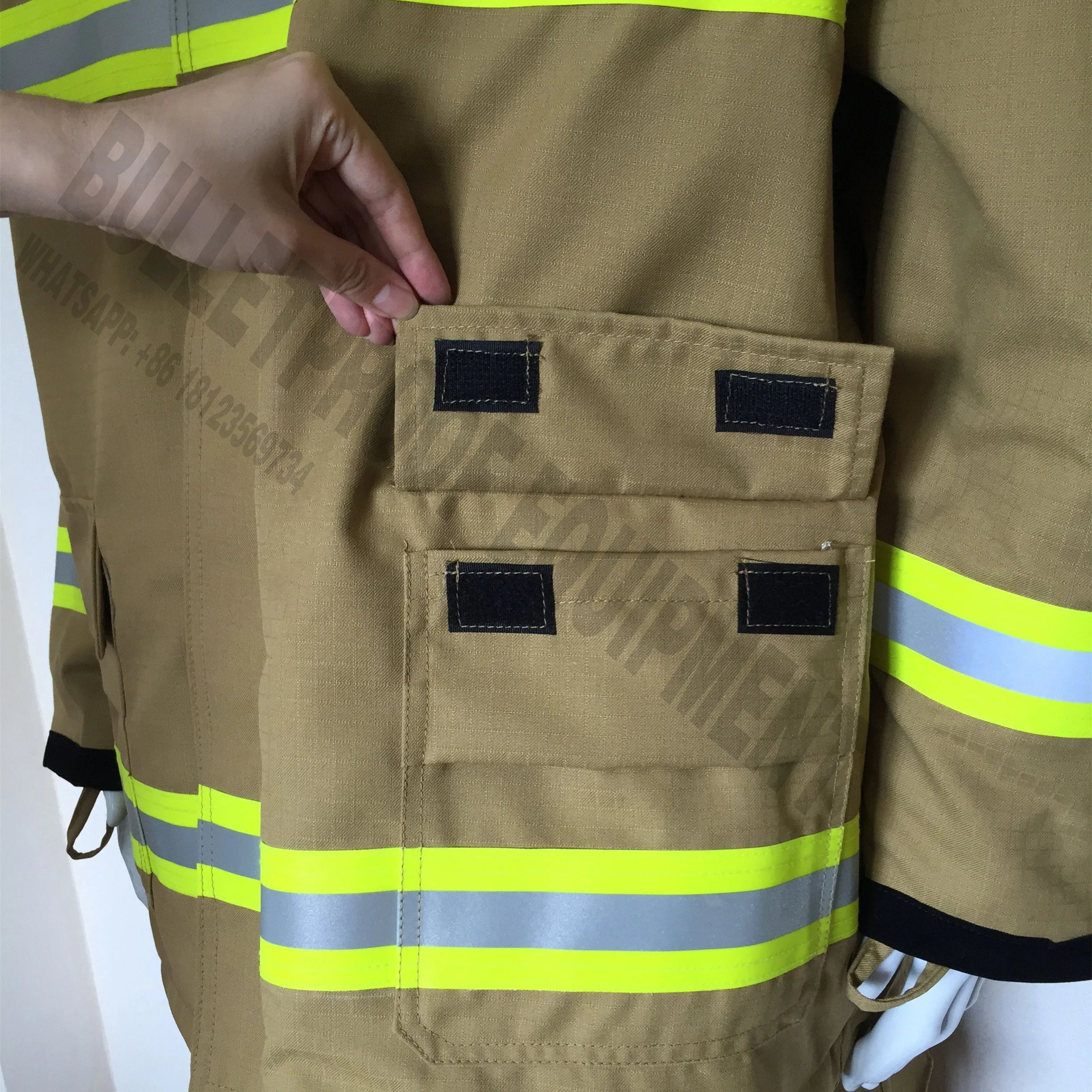 Tan firefighter turnout jacket featuring reflective yellow-silver strips, large Velcro cargo pockets, and durable fabric.