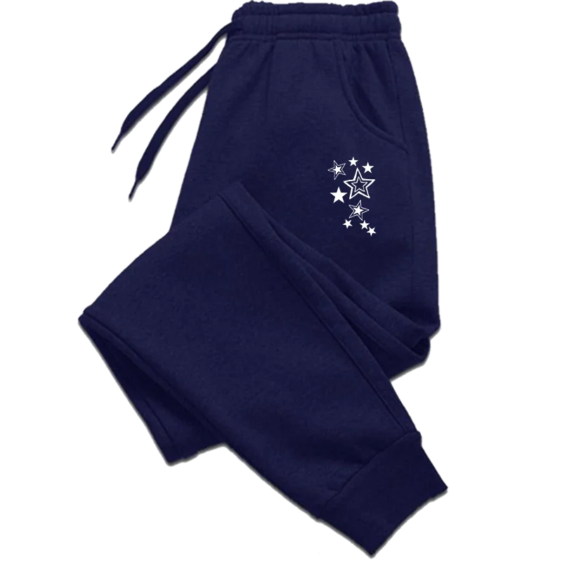 Navy blue joggers with white star graphics, an elasticated drawstring waistband, and cuffed ankles.