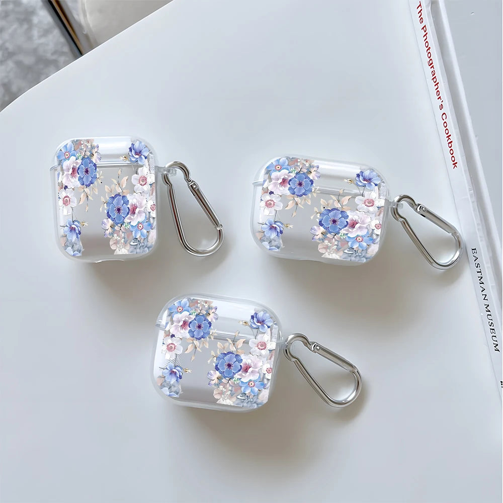 Clear floral-print protective cases for AirPods, with silver carabiners. Compatible with various AirPods models.