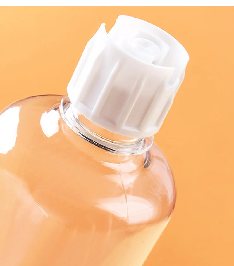 Clear plastic bottle with a white ribbed flip-top cap against an orange background.