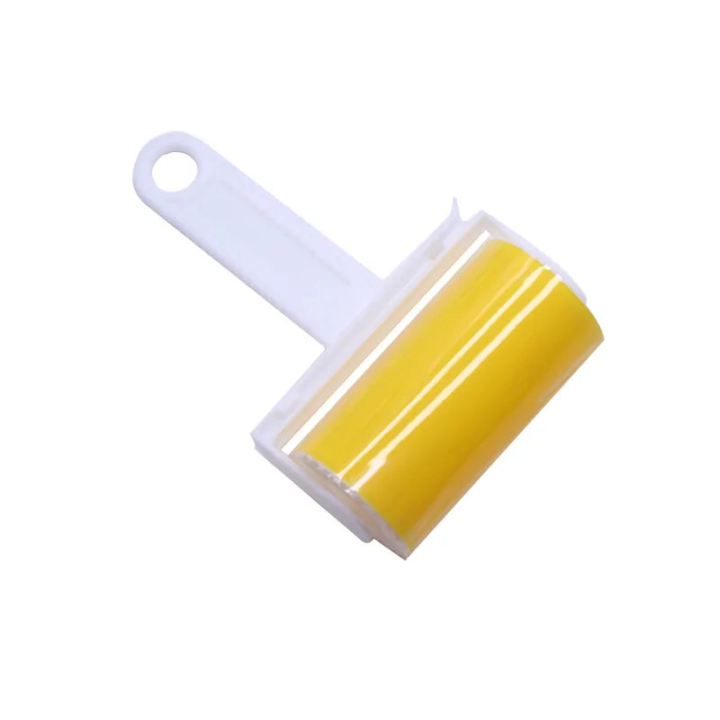 A white handheld sticky lint roller with a bright yellow adhesive drum, isolated on a white background.