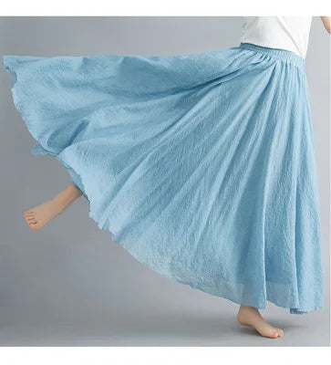 Light blue, flared maxi skirt with an elasticated waist, featuring a textured, flowy design for a breezy feel.