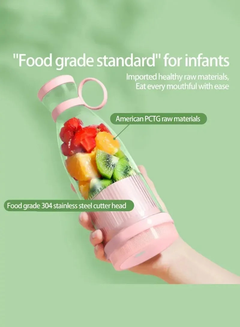 Handheld portable pink blender bottle filled with fresh cut fruits, featuring a sleek design and stainless steel blades.