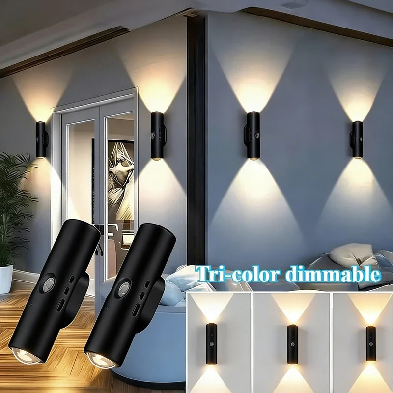 Two black, cylindrical rechargeable wall lights with motion sensors, emitting a dual-beam, tri-colour dimmable light.