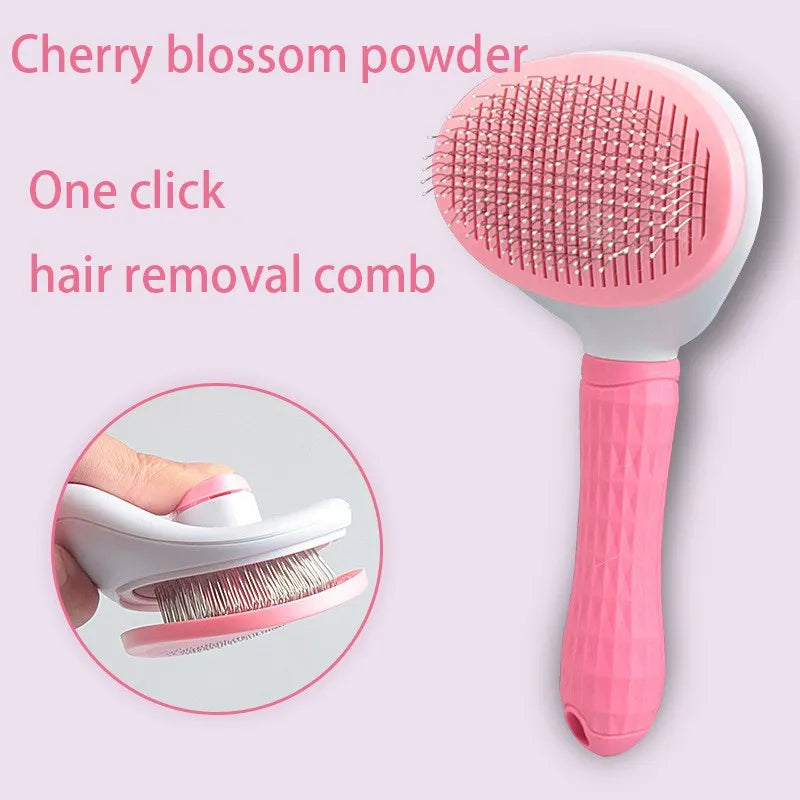 Pink and white self-cleaning pet grooming brush with a textured handle, showing the click hair-removal mechanism.
