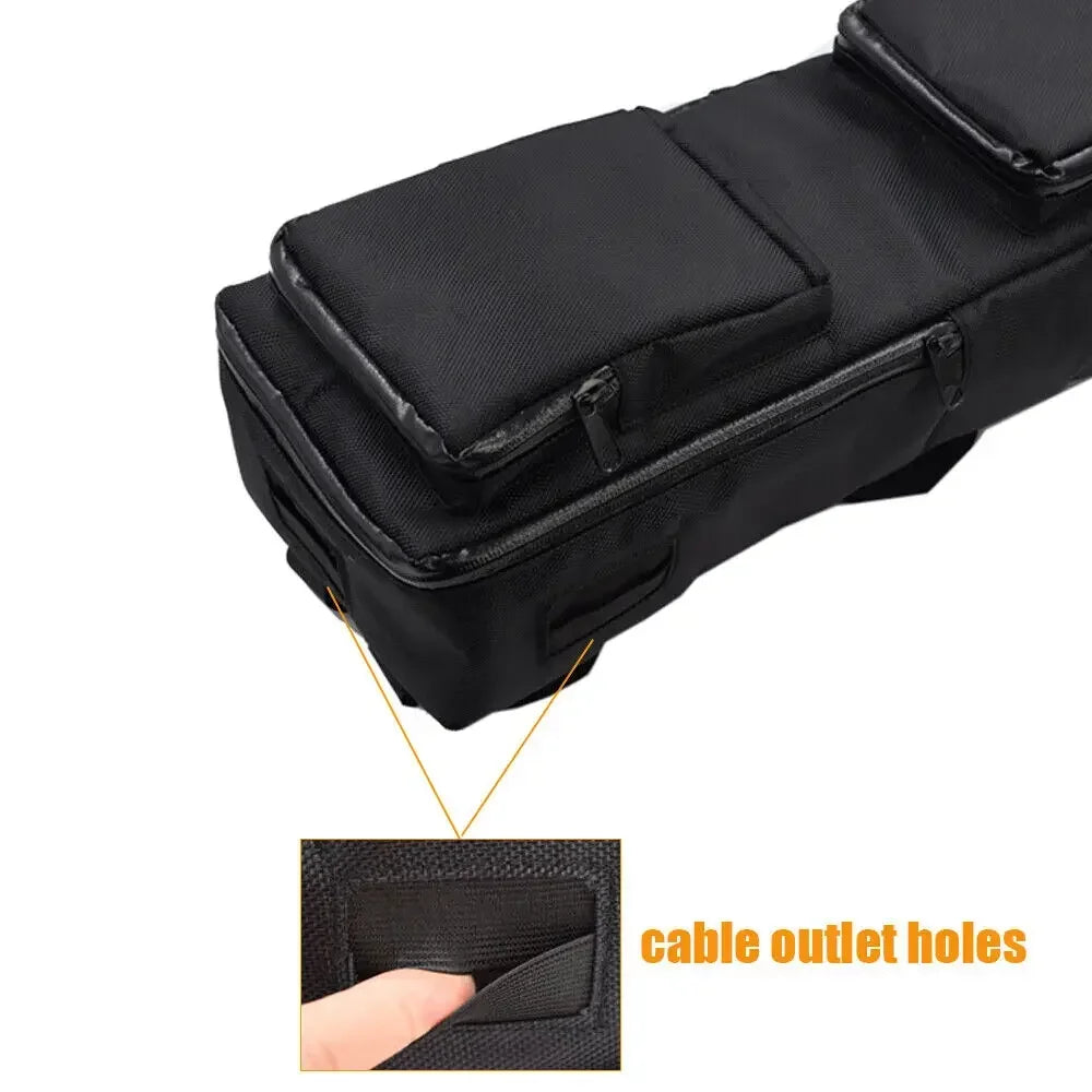 Black elongated e-bike battery storage bag with zippered outer pockets and highlighted cable outlet holes.