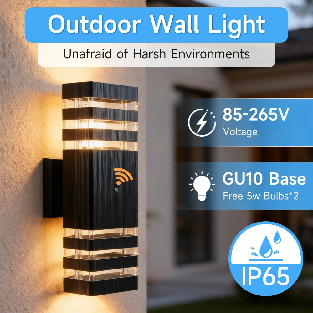 Modern black rectangular outdoor wall light with motion sensor, illuminating a warm glow on an exterior wall.