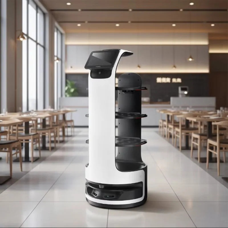 A white and black service robot with shelves stands in a brightly lit restaurant.