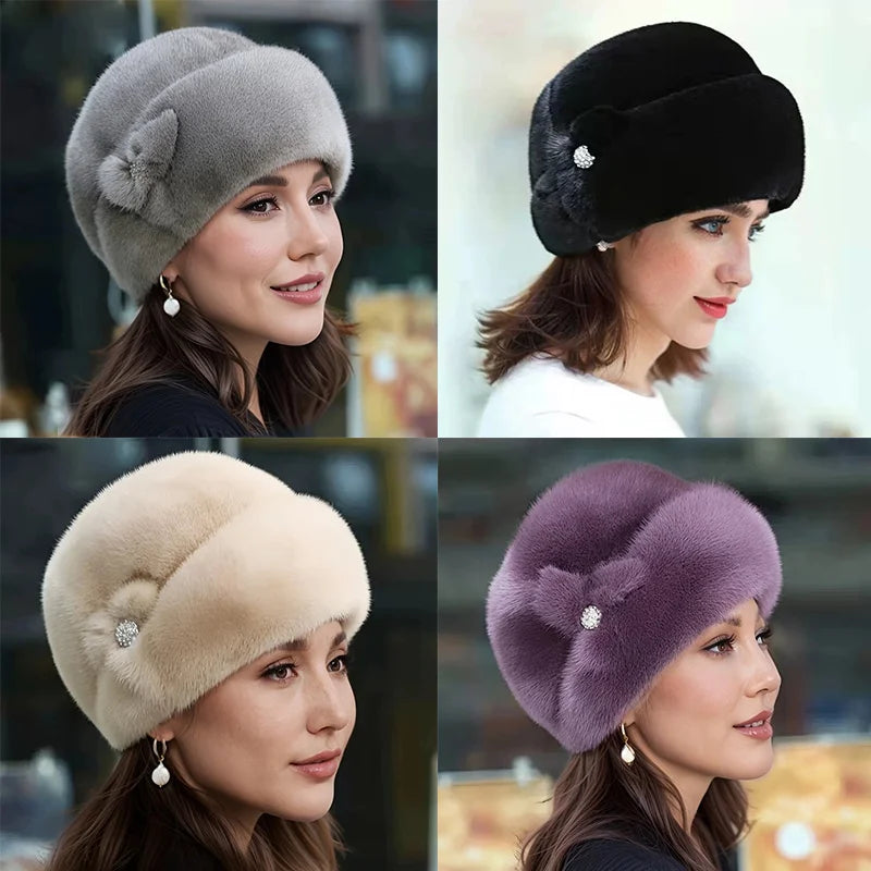 Four models wearing elegant faux fur winter hats in grey, black, cream and purple, each featuring a side crystal detail.