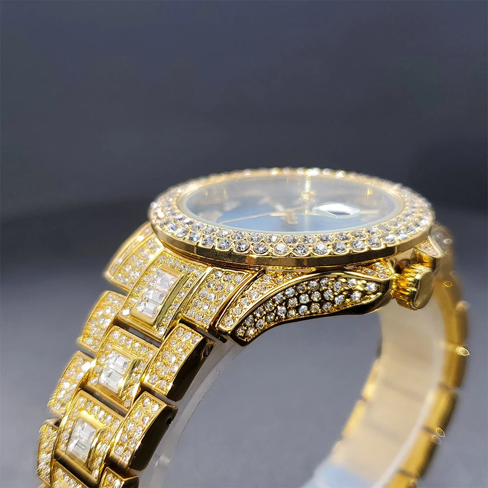 Close-up side profile of a gold-tone women's watch encrusted with sparkling crystals and baguette-cut accents.