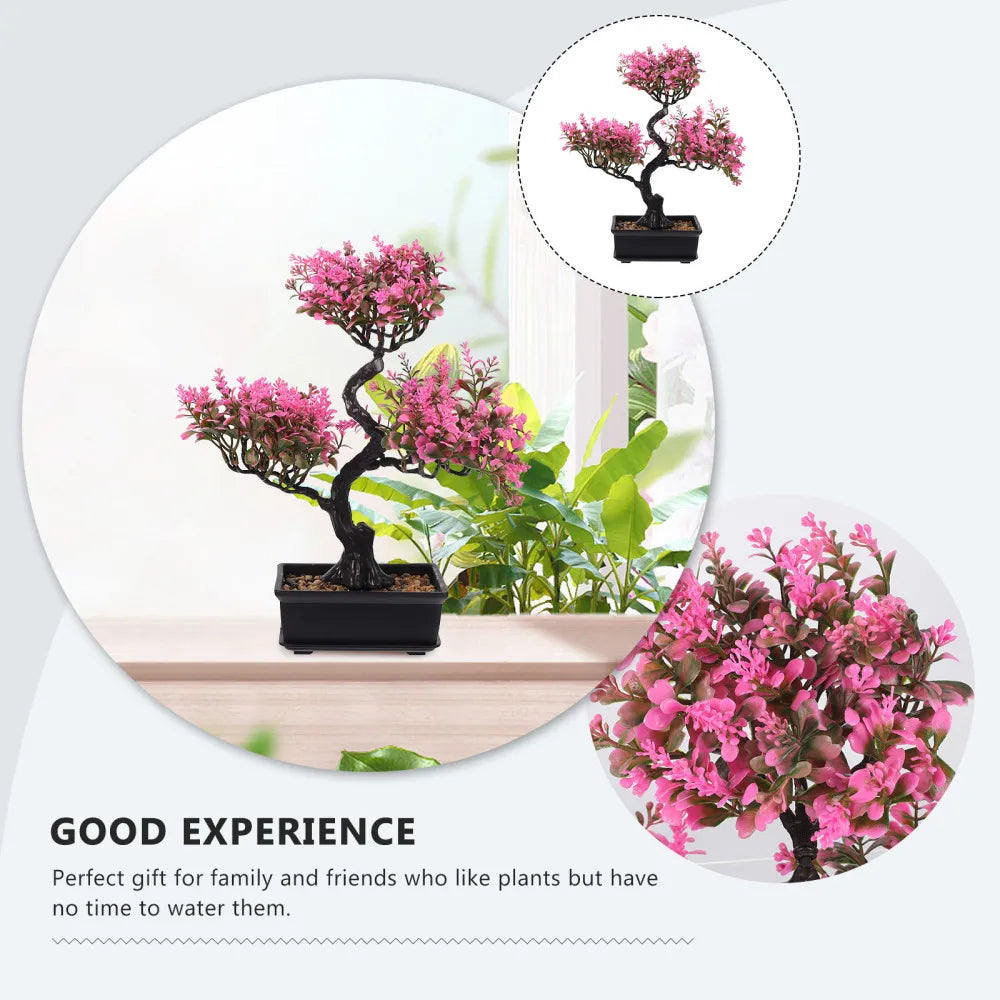 Artificial bonsai tree with vibrant pink foliage and a twisted black trunk in a rectangular black pot.
