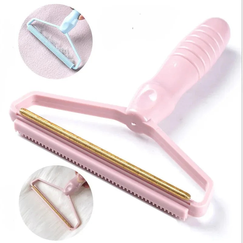 Pink lint remover tool with a gold-tone metal scraper head, used for removing fabric bobbles and pet hair.