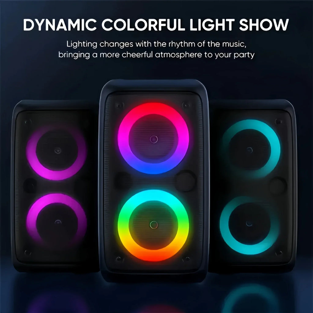 Three black portable Bluetooth karaoke speakers with vibrant, circular, multi-coloured LED lights on a dark background.