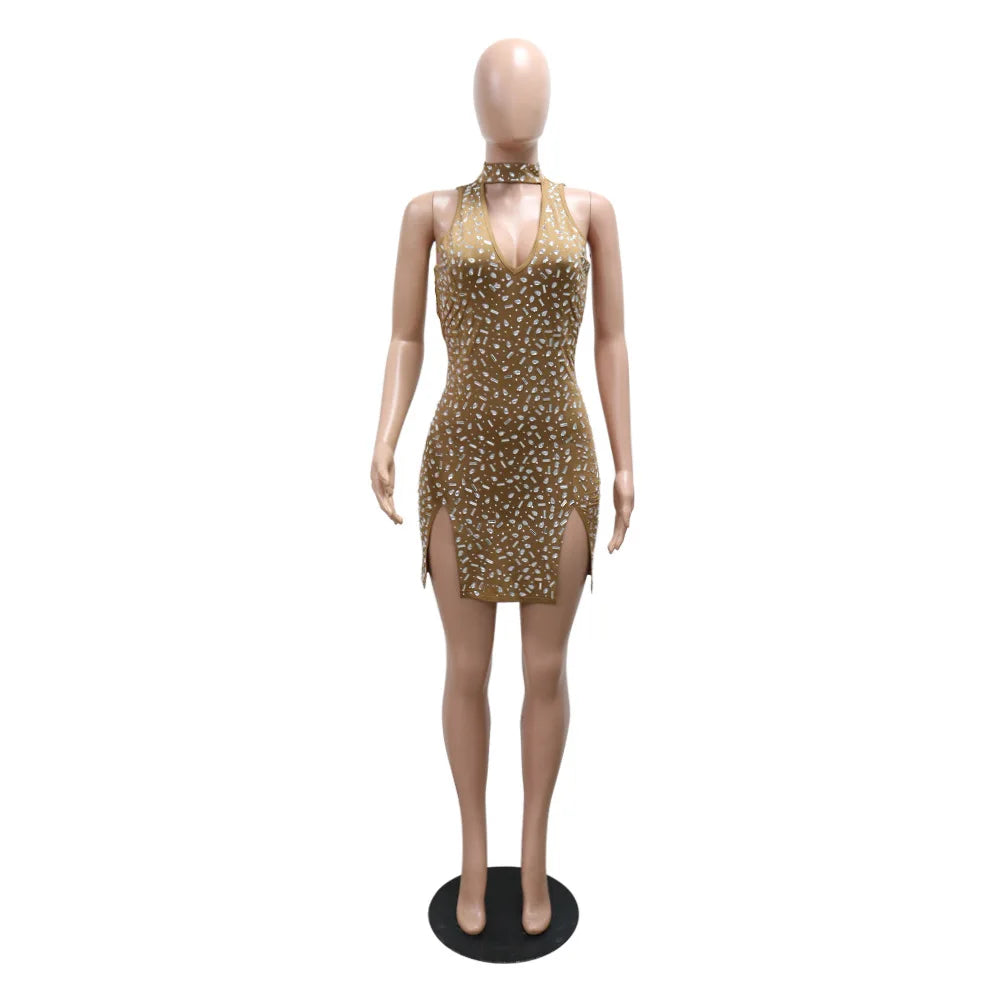 Gold sleeveless bodycon dress with rhinestone embellishments, choker neck, and side slits on a mannequin.