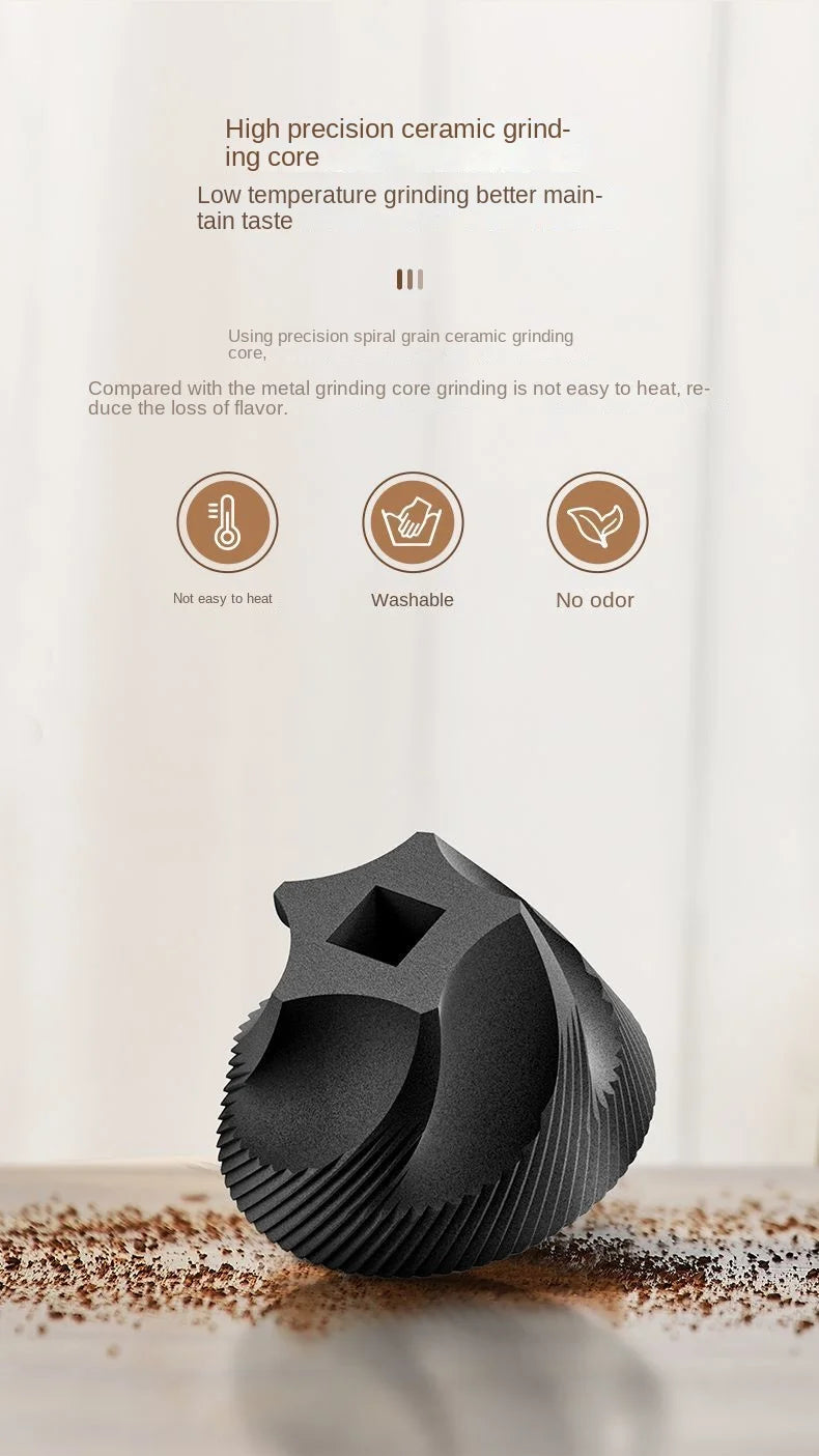 A black, spiral-patterned ceramic coffee grinder core with a central square hole, shown on a textured surface.