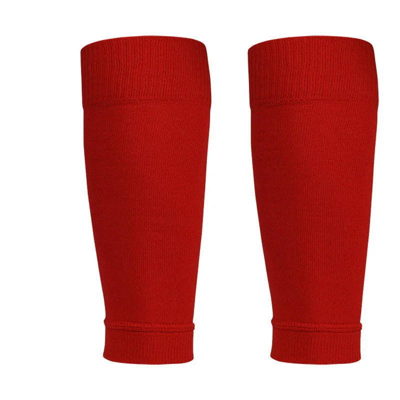 A pair of plain red football stirrup-style leg sleeves with a ribbed elasticated top and base.