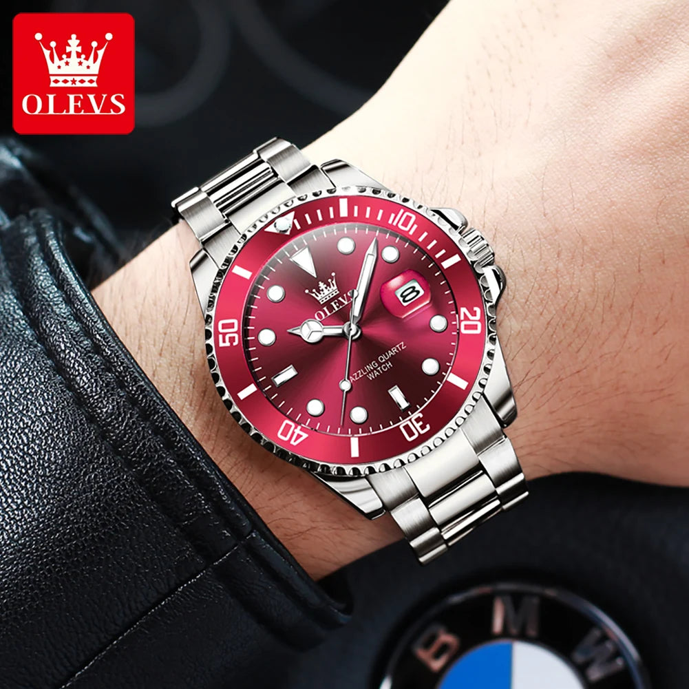 OLEVS stainless steel sport watch with red dial, bezel, date window, and luminous hands on a wrist.