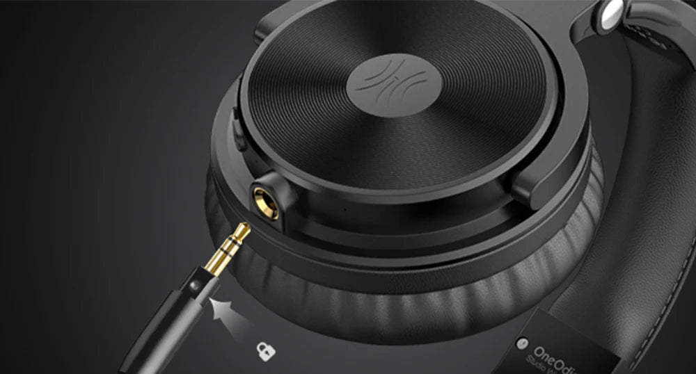 Close-up of black, over-ear wireless headphones featuring a locking 3.5mm audio jack port.