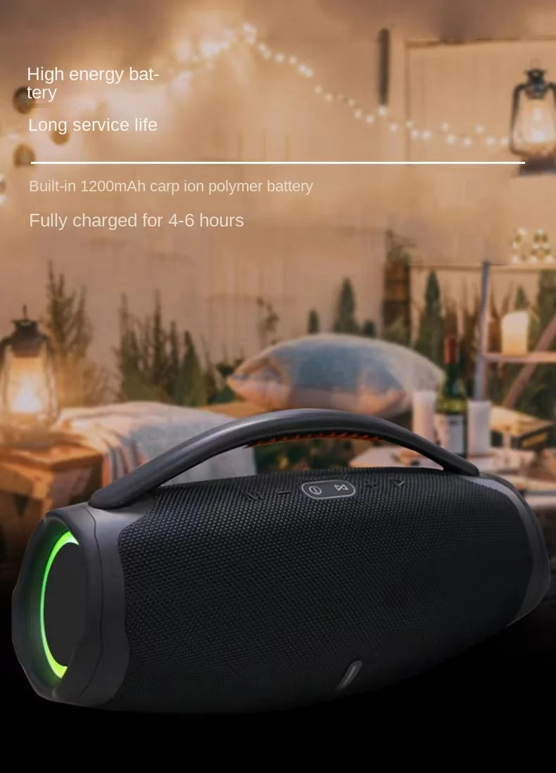 Black portable Bluetooth speaker with a top carry handle and circular green RGB light accents on the sides.