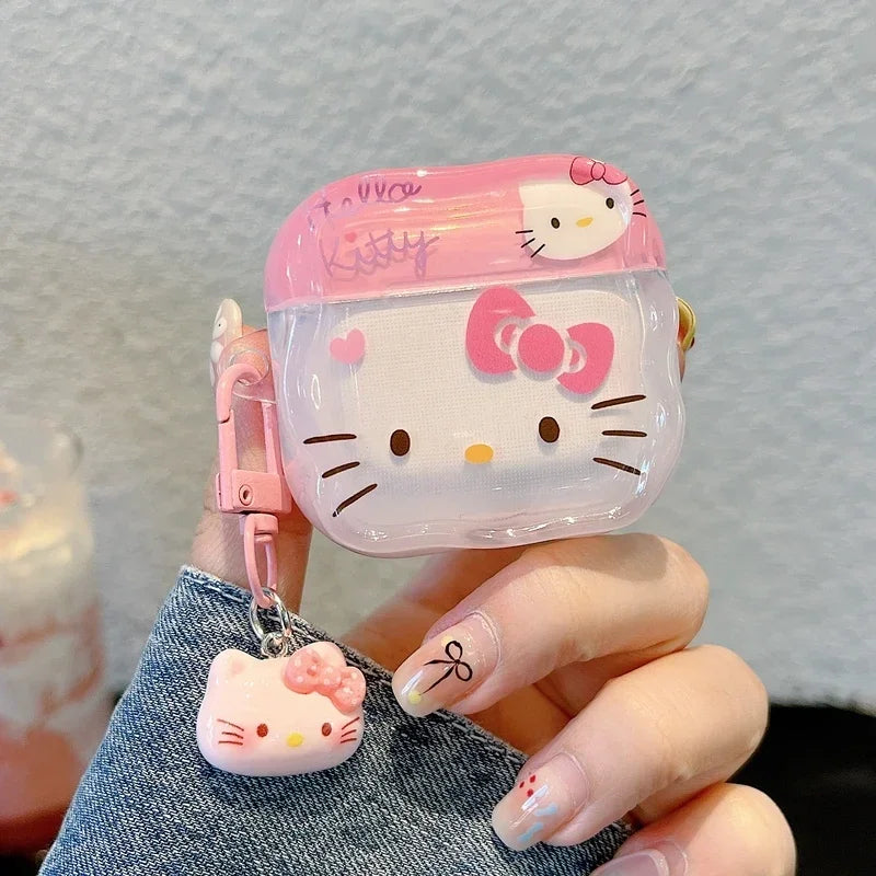 Clear Hello Kitty AirPods case in pink, featuring a matching charm and clip. Compatible with standard AirPods models.