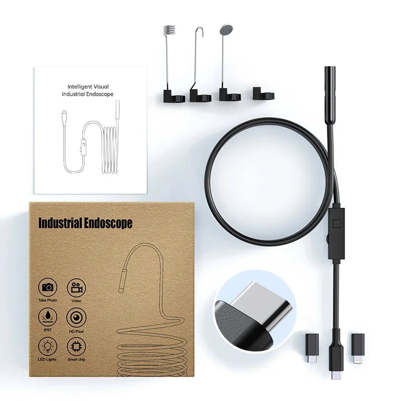 HD industrial endoscope kit with camera cable, attachments, user manual, and USB-C/Lightning adapter tips in a box.
