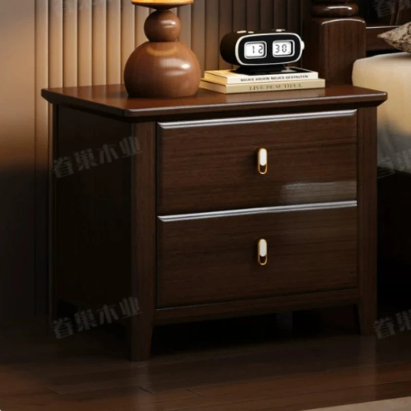 Retro dark wood bedside table with two drawers, featuring gold-tone pulls and a polished finish.