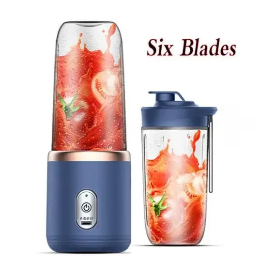 Portable navy blue personal blender with six blades, rose gold accent, and a matching travel cup filled with smoothie.