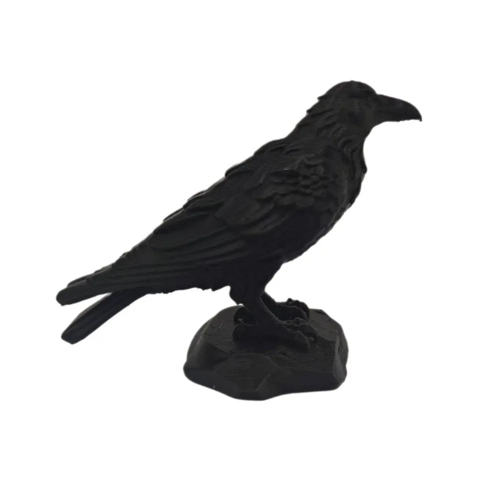 Matte black raven bird figurine perched on a stone-effect base, featuring detailed 3D-printed texture.