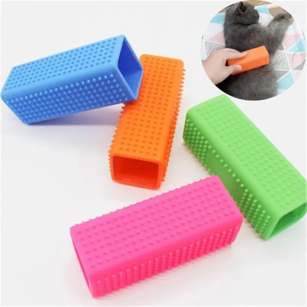 Four rectangular silicone pet grooming brushes in blue, orange, green, and pink, with a small inset showing usage.