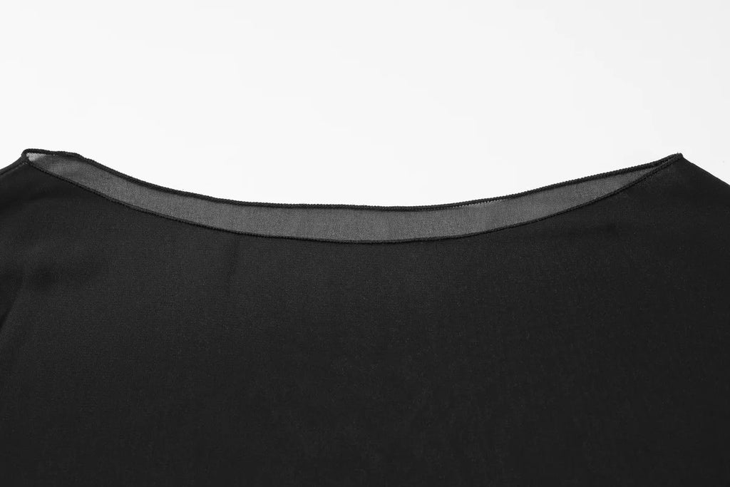 Close-up of a black top featuring a wide, elegant boat neckline with a sheer mesh trim detail.