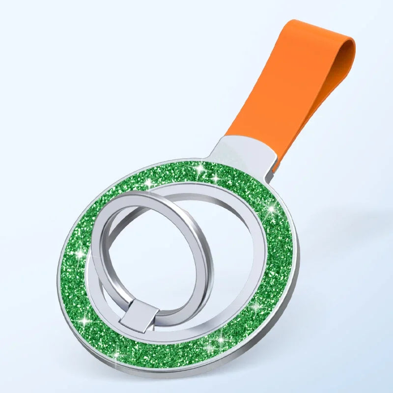 A circular phone ring holder with a sparkling green glitter rim, silver accents, and an orange wrist strap.