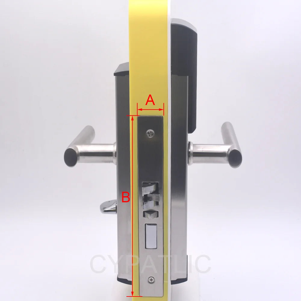 Stainless steel electronic door lock with lever handles, mounted on a yellow door edge with red measurement markings.