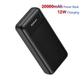 Black 20,000mAh portable power bank with a textured finish, multiple charging ports, and an LED battery indicator.