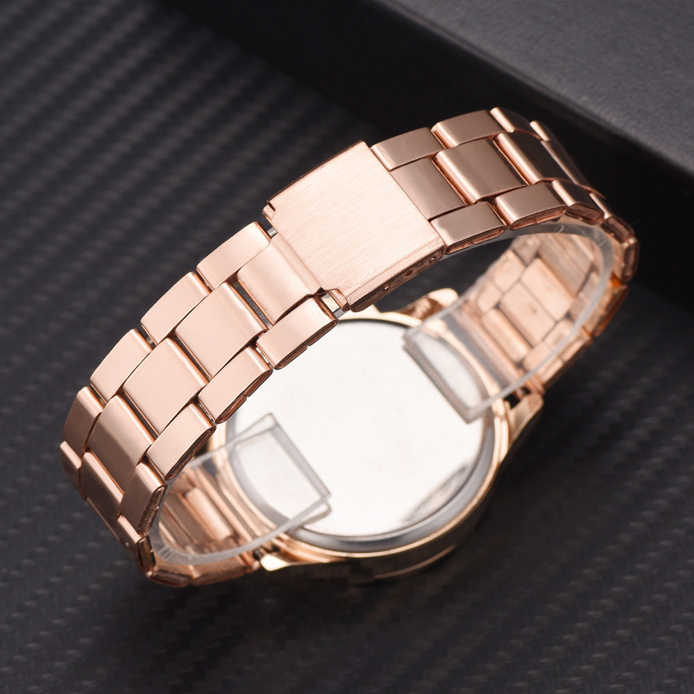 Ladies' rose gold stainless steel wristwatch, showcasing the polished link bracelet and secure clasp from the back.