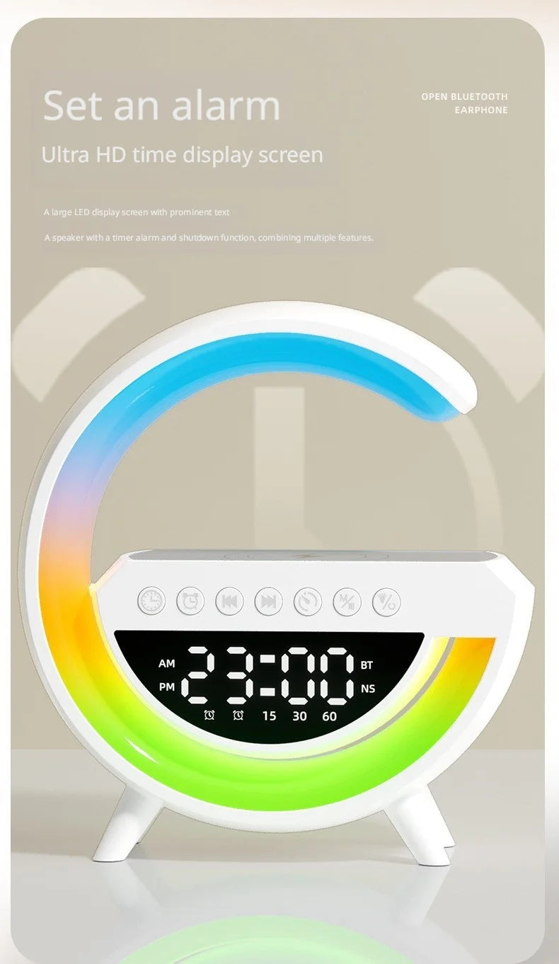 White smart alarm clock with a colourful LED arc, digital display, wireless charging pad and Bluetooth speaker.