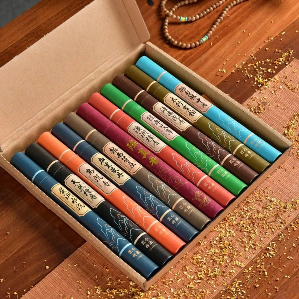 Gift box containing ten assorted colourful tubes of incense sticks with traditional oriental design labels.