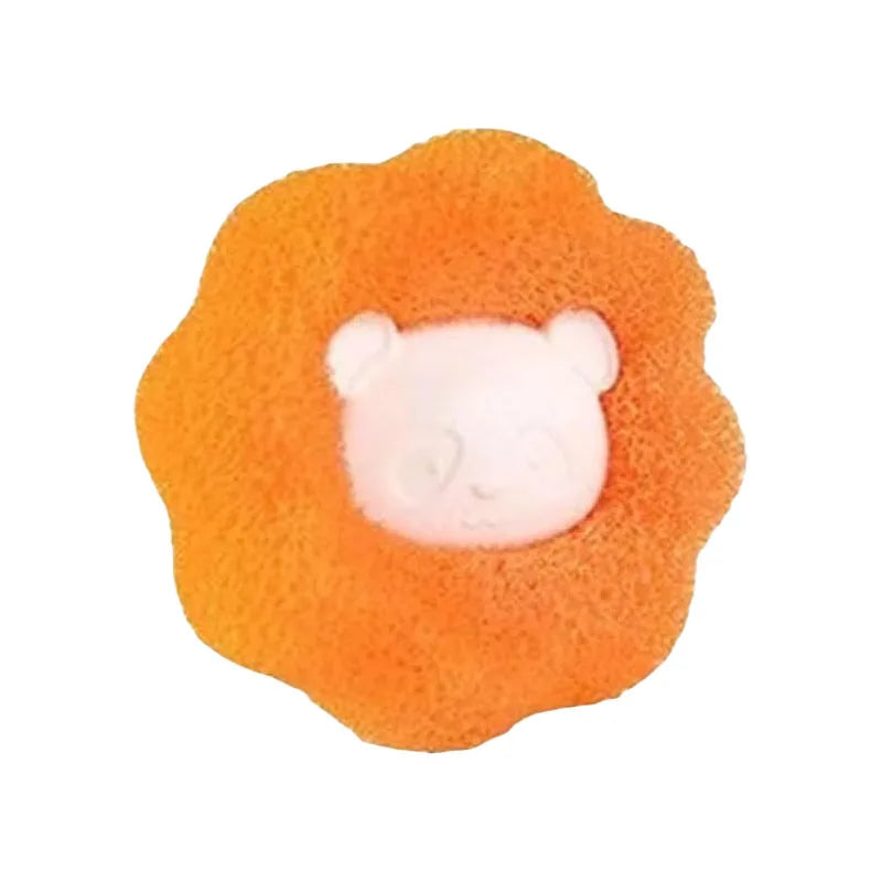 A sponge shaped like a lion’s head with a bright orange, textured mane and a pale cream centre.
