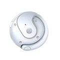 A white, circular motion-sensor light with a modern, yin-yang inspired split design and center light diffuser.