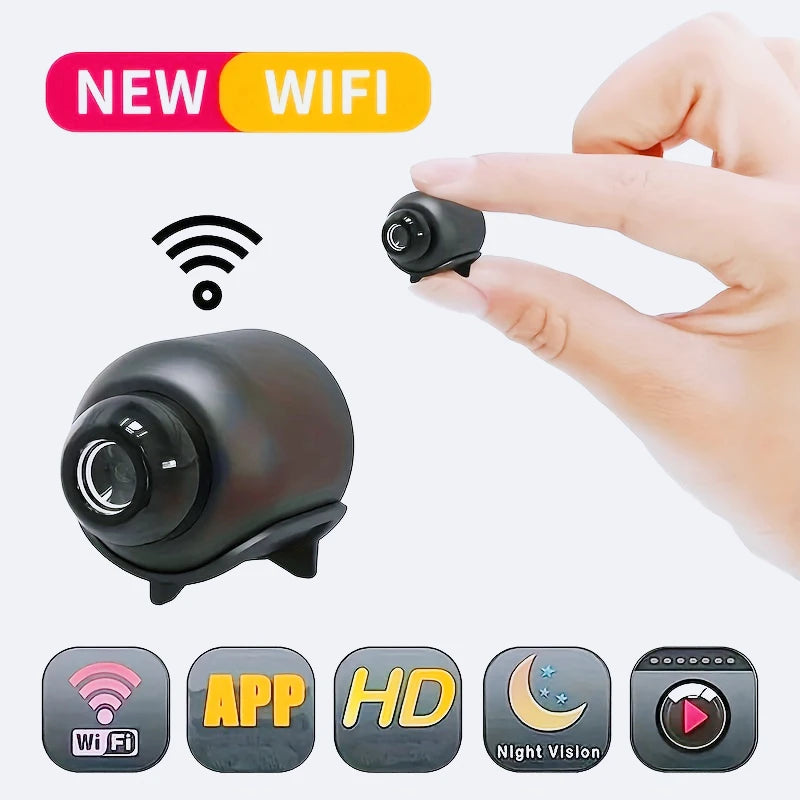 Small, black wireless security camera with night vision, motion alarm, and HD recording, shown held in fingers.