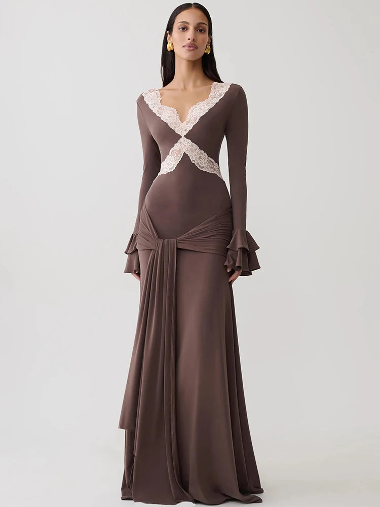 Brown maxi dress with white lace V-neck, long flared ruffle sleeves, draped waist, and mermaid silhouette.