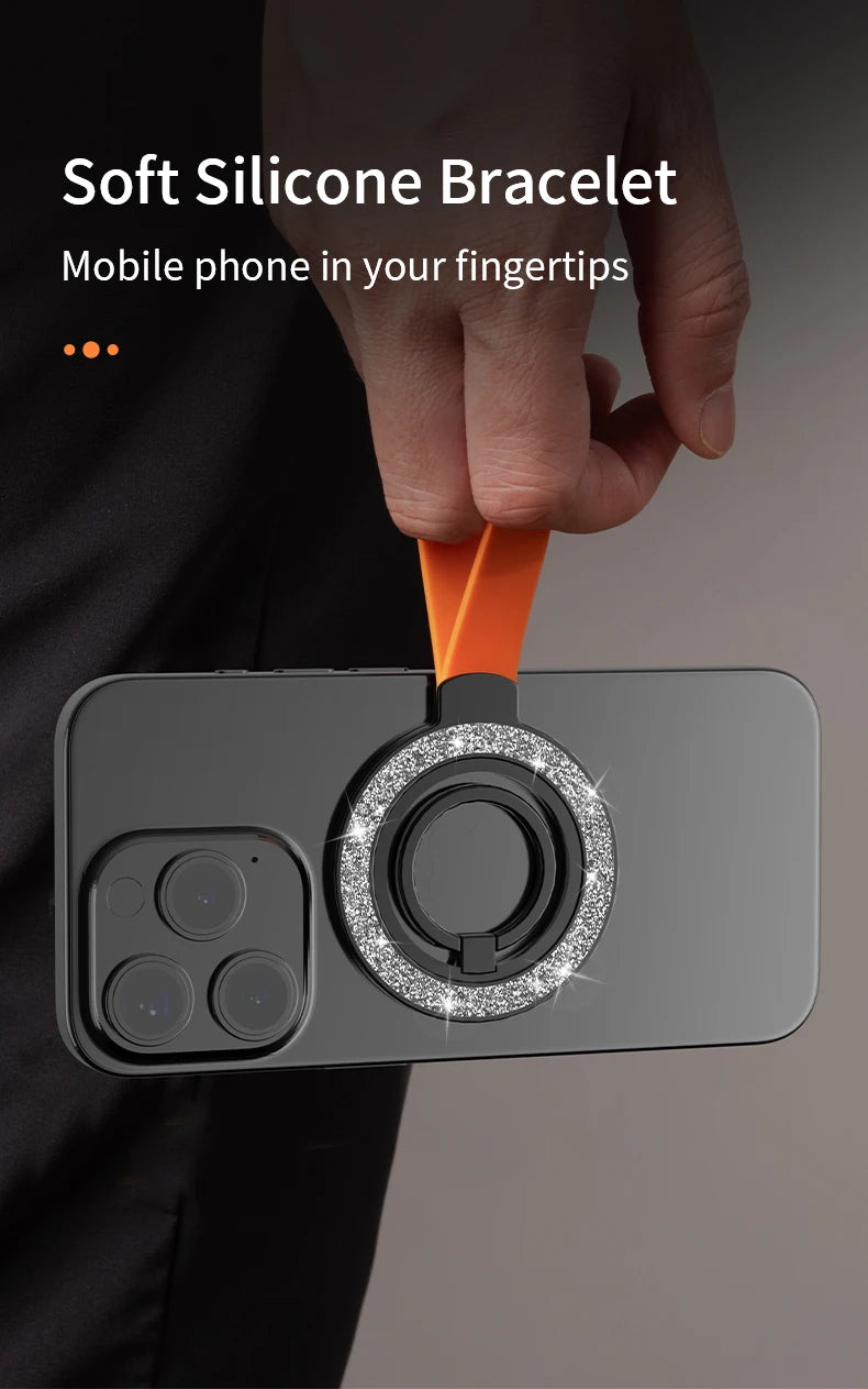 Orange silicone phone bracelet with a sparkly, glittery ring attachment held by a hand.