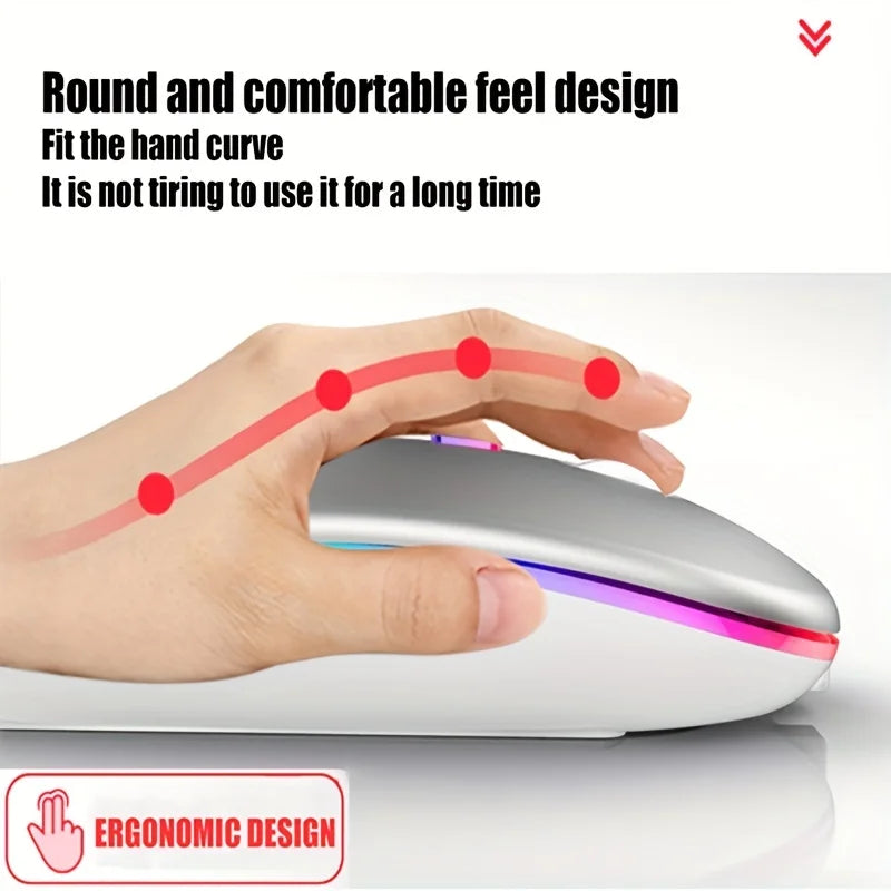 Ergonomic silver wireless mouse with a slim, rounded design and colourful ambient lighting under the hand.