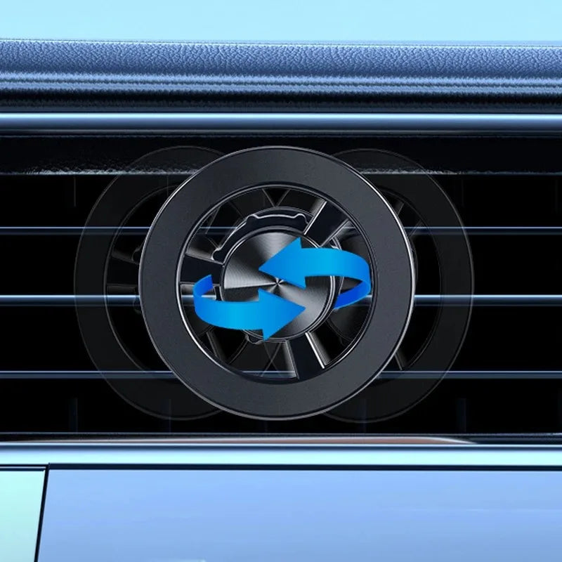 Black circular car air vent fragrance clip with a brushed metallic center and rotating blue directional arrows.
